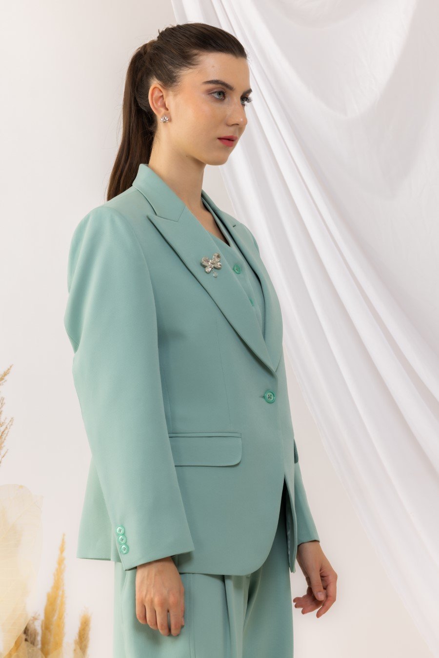 Sea Green Single Button Blazer With Flap Side Pockets Features with a Brooch
